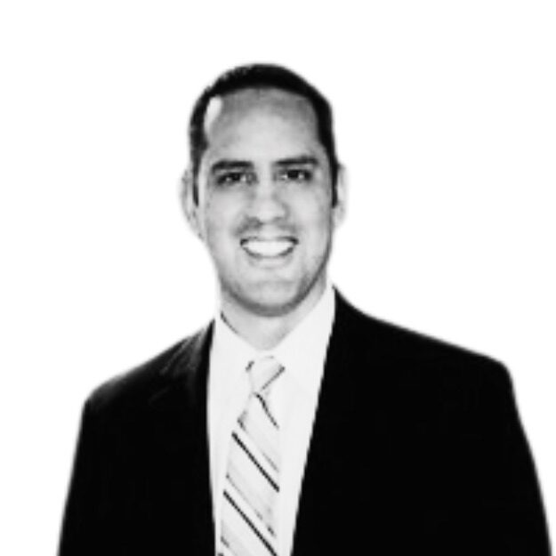 Smiling man in a suit and tie.