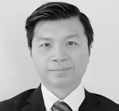 Professional portrait of a man in suit.