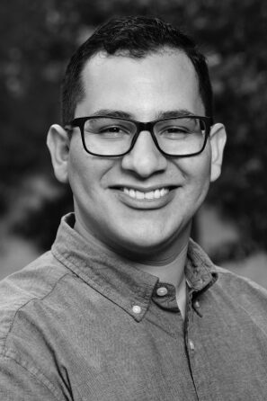 Smiling man in a casual shirt portrait.